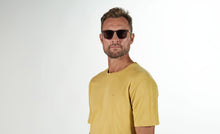Load image into Gallery viewer, PREGO sunglasses in the color Translucent Graphite made from cotton-based acetate. Our well-known quality allows for individual adjustments so your sunglasses always fit perfectly. The gray lenses match perfectly and protect your eyes from the sun's harmful UV rays. If you need prescription lenses in your PREGO sunglasses, contact your local optician. We collaborate internationally with the best opticians.